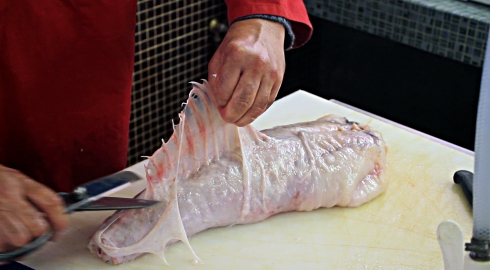 cutting skin of monkfish